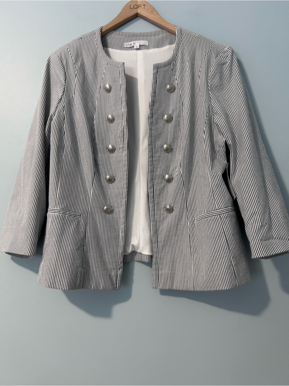 Cleo stripped jacket in size L. Faux front slit pockets.  Never worn